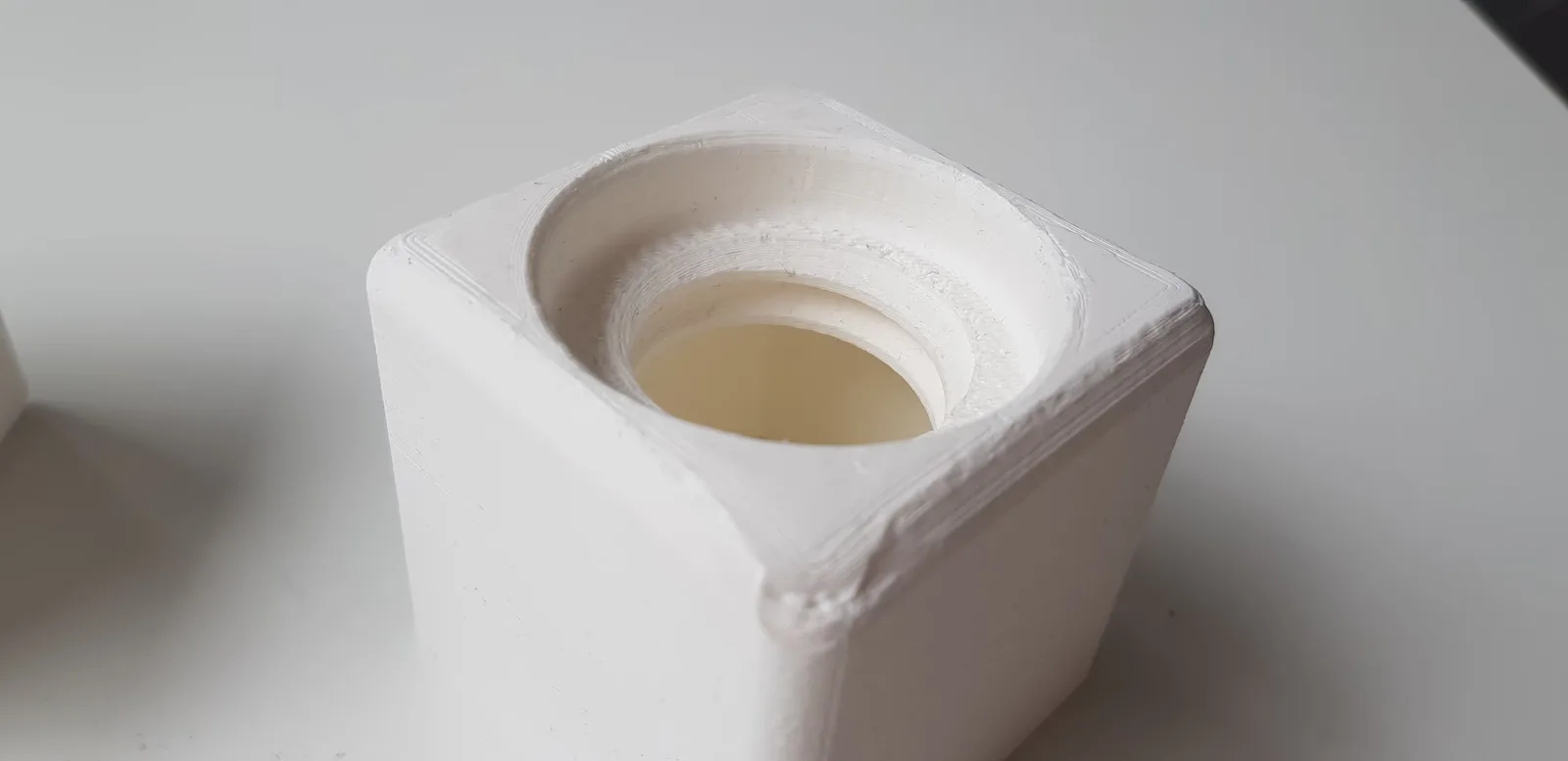 A photo of one of the 3D printed prototypes of the box, testing the screw type.