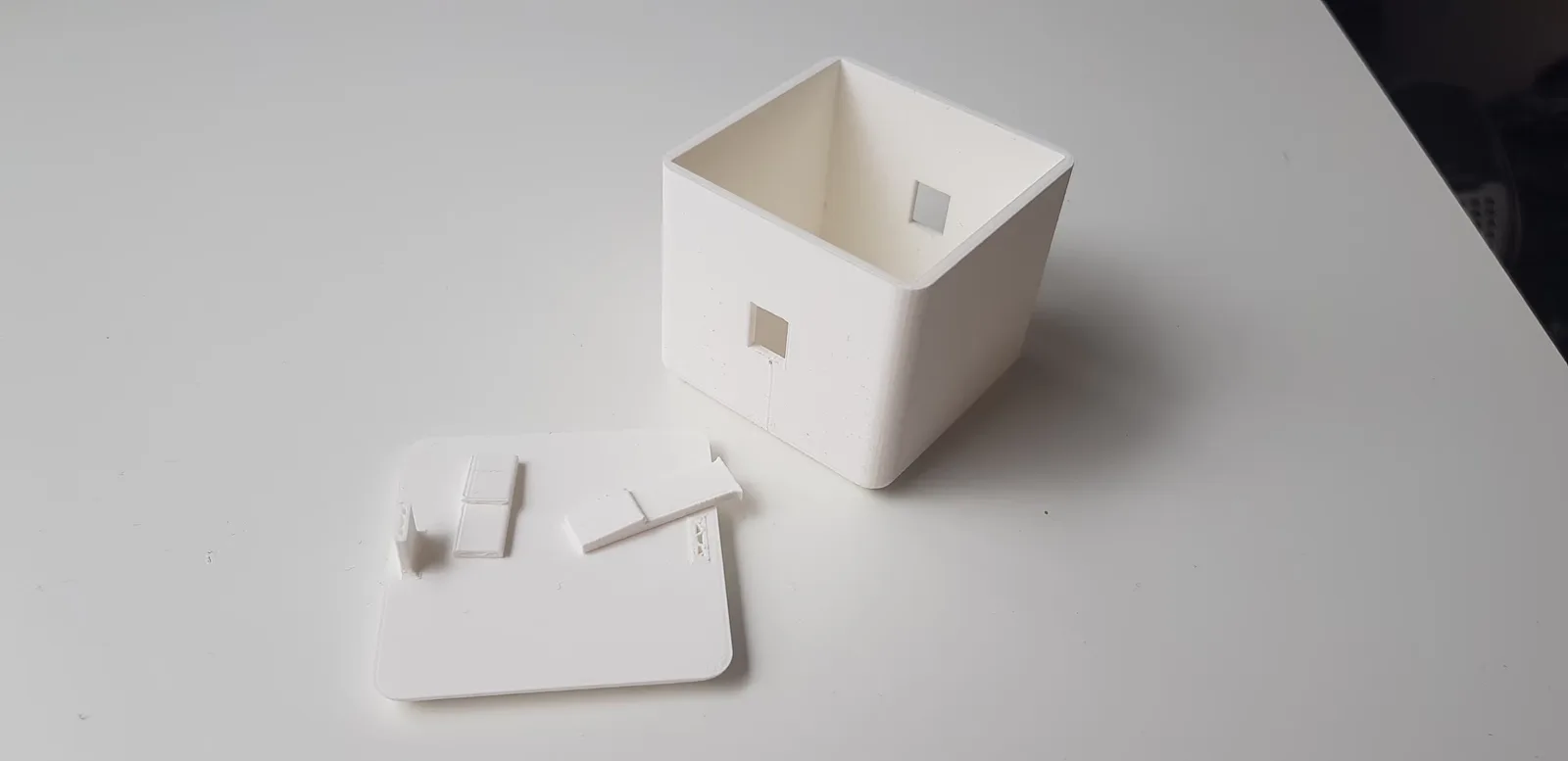 A photo of one of the 3D printed prototypes of the box, showing how easily the mechanism breaks